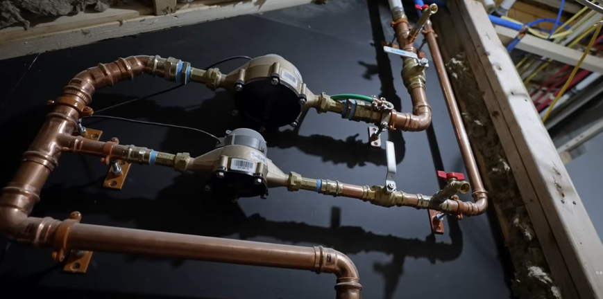 Pressure regulating valve and shutoff assembly plumbed in copper on an exterior wall