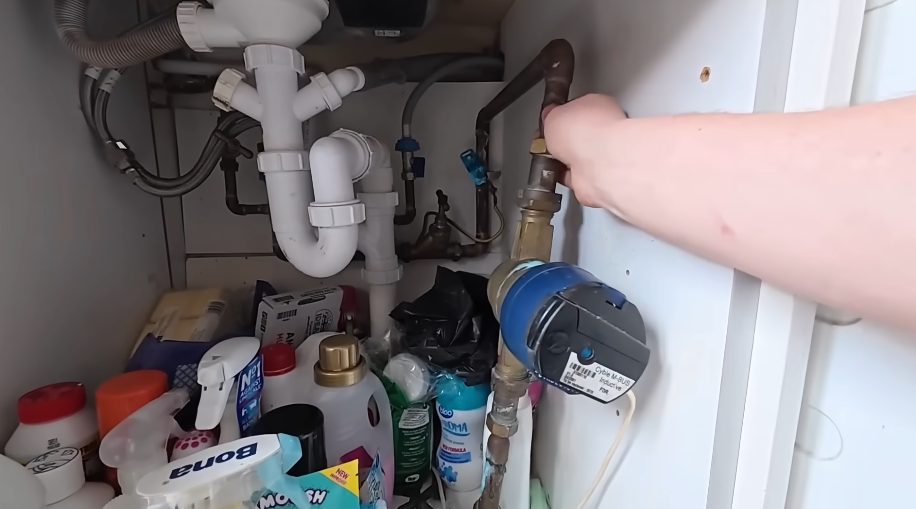 Turning the angle stop shutoff valve under a kitchen sink
