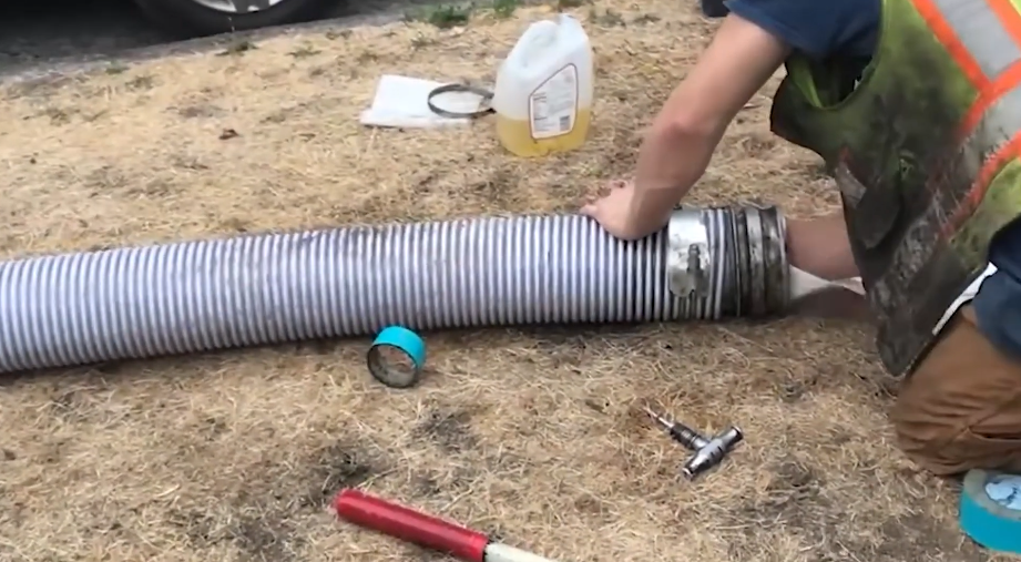 Large corrugated flexible sewer pipe laid out on site before installation