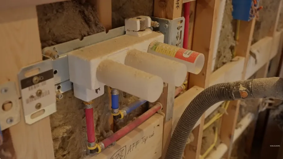 Shower valve and new supply lines in an open bathroom wall, where hard water scale can build up in Old Town Tustin homes